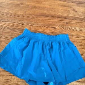 Lululemon Hotty Hot High-Rise Lined Shorts in the color "Poolside Blue” sz M